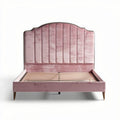 Velvet upholstered queen bed frame in soft pink color with wooden slats